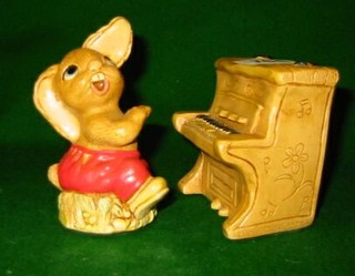 A Beswick figure of a girl playing a piano "Good Night" (af)