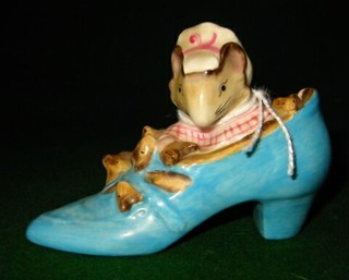 A Beatrix Potter figure "The Old Woman Who Lived in a Shoe"