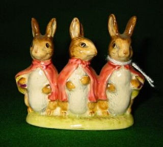 A Beatrix Potter figure "Flopsy, Mopsy and Cottontail"