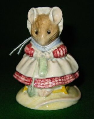 A Beatrix Potter figure "The Old Woman Who Lived in a Shoe, Knitting"