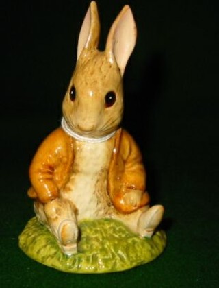 A Beatrix Potter figure "Benjamin Bunny Sat on a Bank"