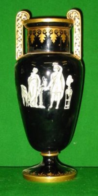 A 19th/20th Century black glazed "Jackville" twin handled vase decorated classical figures 12"