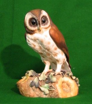 A Royal Crown Derby porcelain figure of a brown owl, the base marked XL11, 10"