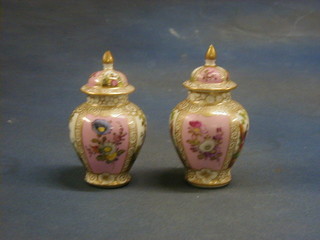 A pair of late Dresden porcelain urns and covers with panel decorated depicting romantic scenes 6" (1f and r)