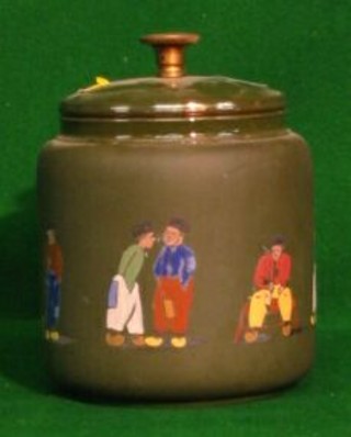 A green glazed pottery tobacco jar decorated Dutchman 6"