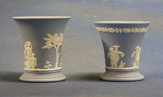 A Wedgwood blue Jasperware trumpet shaped vase marked 68 W, 6", 2  Wedgwood blue Jasperware trumpet shaped vases 4" and 3 1/2" the bases marked Wedgwood 68 and 67