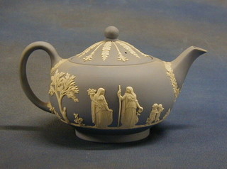 A circular Wedgwood teapot, the base marked Wedgwood and impressed M1