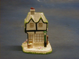 A Coalport porcelain cottage "The Old Curiosity Shop"