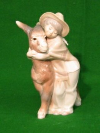 A Lladro figure of boy and donkey impressed 10, 9"