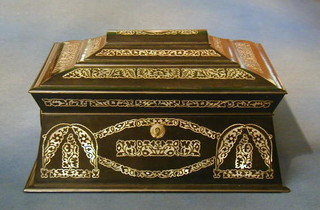 A Victorian ebonised inlaid mother of pearl sarcophagus shaped sewing box with hinged lid, the interior containing 3 silver thimbles, cotton reels etc 13"
