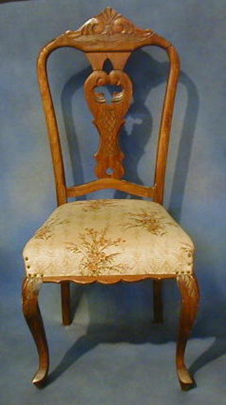 A set of 5 French walnutwood Chippendale style dining chairs on cabriole supports