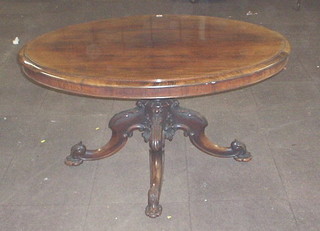 A fine quality Victorian snap top breakfast table, raised on a carved column and tripod supports 54"