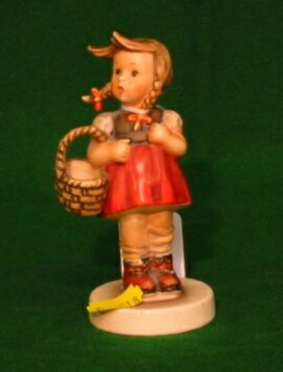 A Goebal figure of a girl with basket, marked 96 5"