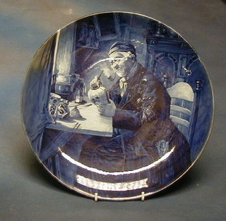 A 19th Century Delft pottery plate by Uoost Thooft & Labouchere, "The Pot Painter" the back marked Delft J, 14"