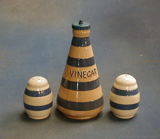 A blue and white striped vinegar bottle and a blue and white banded salt and pepper pot