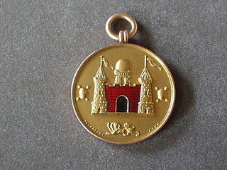 A 9ct gold Surrey County FA medallion