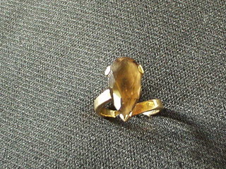 A 9ct gold dress ring set a heart cut smokey quartz