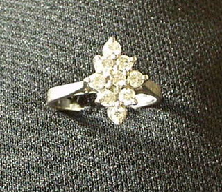 An 18ct white gold dress ring set 9 diamonds