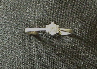 A diamond solitaire engagement ring