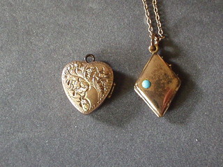 A gilt metal heart shaped locket and a gilt metal chain hung a gilt locket
