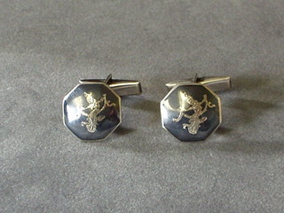 A pair of silver cufflinks with nielo decoration