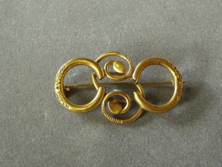 A gilt metal brooch