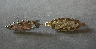 A silver brooch marked Mizpan and a pierced silver and gold brooch 