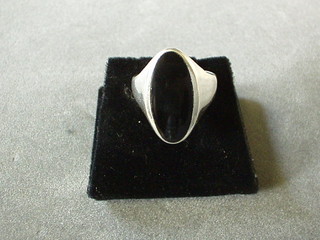 A silver dress ring set a black hardstone