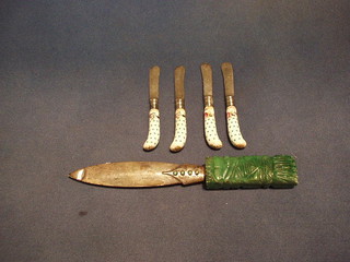 A Continental silver bladed paper knife with carved green hardstone handle and 4 19th Century silver plated butter knives with porcelain pistol grip handles