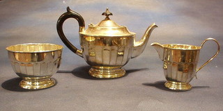 A circular silver plated 3 piece tea service