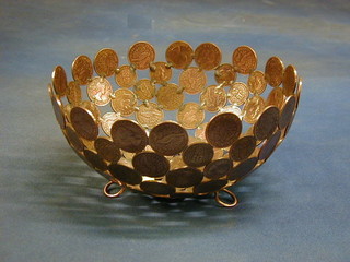 A circular copper bowl constructed from various 1950's and later New Zealand pennies