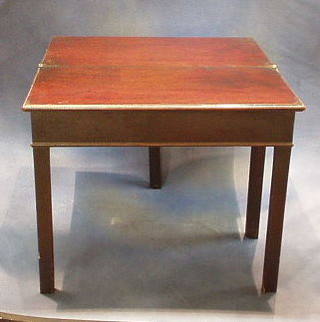 A Georgian mahogany miniature tea table, raised on square chamfered supports 27"