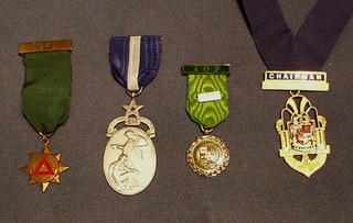 A silver gilt and enamel Past Chairman's jewel of Tooting Urban District Council, a silver Royal Masonic Hospital Governor's jewel, an Ancient Order of Oddfellows jewel and a Safe Driving medal