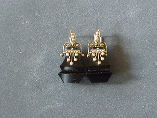 A  pair of 19th Century black hardstone drop earrings, gold mounted and set demi-pearls