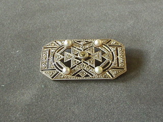 A  lady's attractive Art Deco white gold brooch set numerous diamonds and 4 pearls