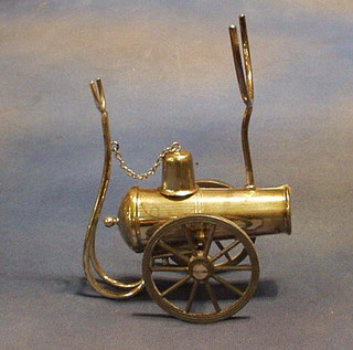 A silver plated brandy warmer in the form of a canon