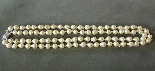 A rope of 86 pearls with gold and diamond clasp