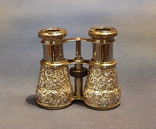 A pair of French fine quality Victorian embossed silver opera glasses by Le Jockey Club Paris, contained in an embossed silver case, Birmingham 1891