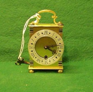 A 20th Century carriage type timepiece with enamelled dial and Roman numerals contained in a chromed case