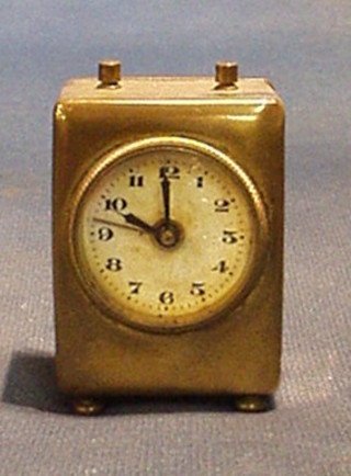 A 19th/20th Century brass cased alarm clock 3"