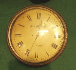 A 19th Century striking fusee wall clock by James McCabe London, with 12" painted dial, contained in a mahogany case with brass bezel