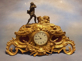 A French 19th Century gilt spelter clock case surmounted by a bronze figure of a classical gentleman playing a harp