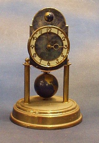 A 1950's 400 day clock decorated phases of the moon, with gilt chapter ring and Arabic numerals, by J Kaiser of Germany