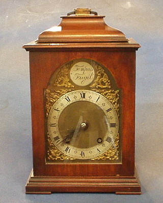 A 1940's reproduction bracket clock with silvered chapter ring, Roman numerals, contained in a walnutwood case