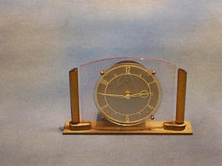 An Art Deco electric mantel clock in a glass case by Temco