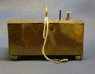 An 18th Century rectangular brass twin compartment "Honesty Tobacco Box" complete with key, raised on bun feet 10"