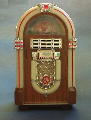 A reproduction plastic duke box radio cassette player
