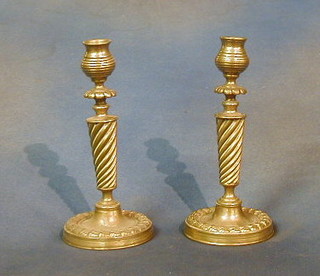 A pair of 19th Century brass candlesticks with swirled columns and pierced cast bases (no sconces) 8"