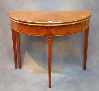 A Georgian mahogany demi-lune tea table inlaid satinwood stringing, raised on square tapering 36"