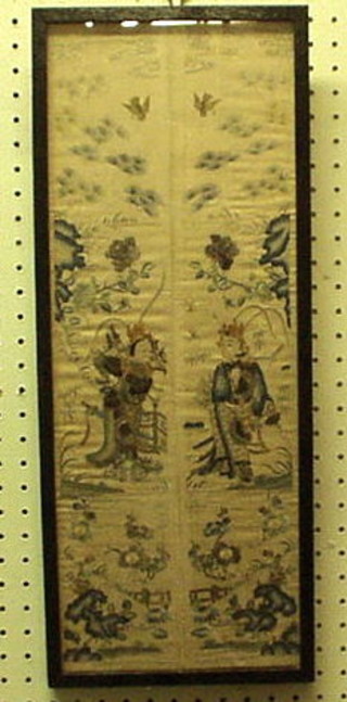 An Oriental silk work panel contained in an oak frame